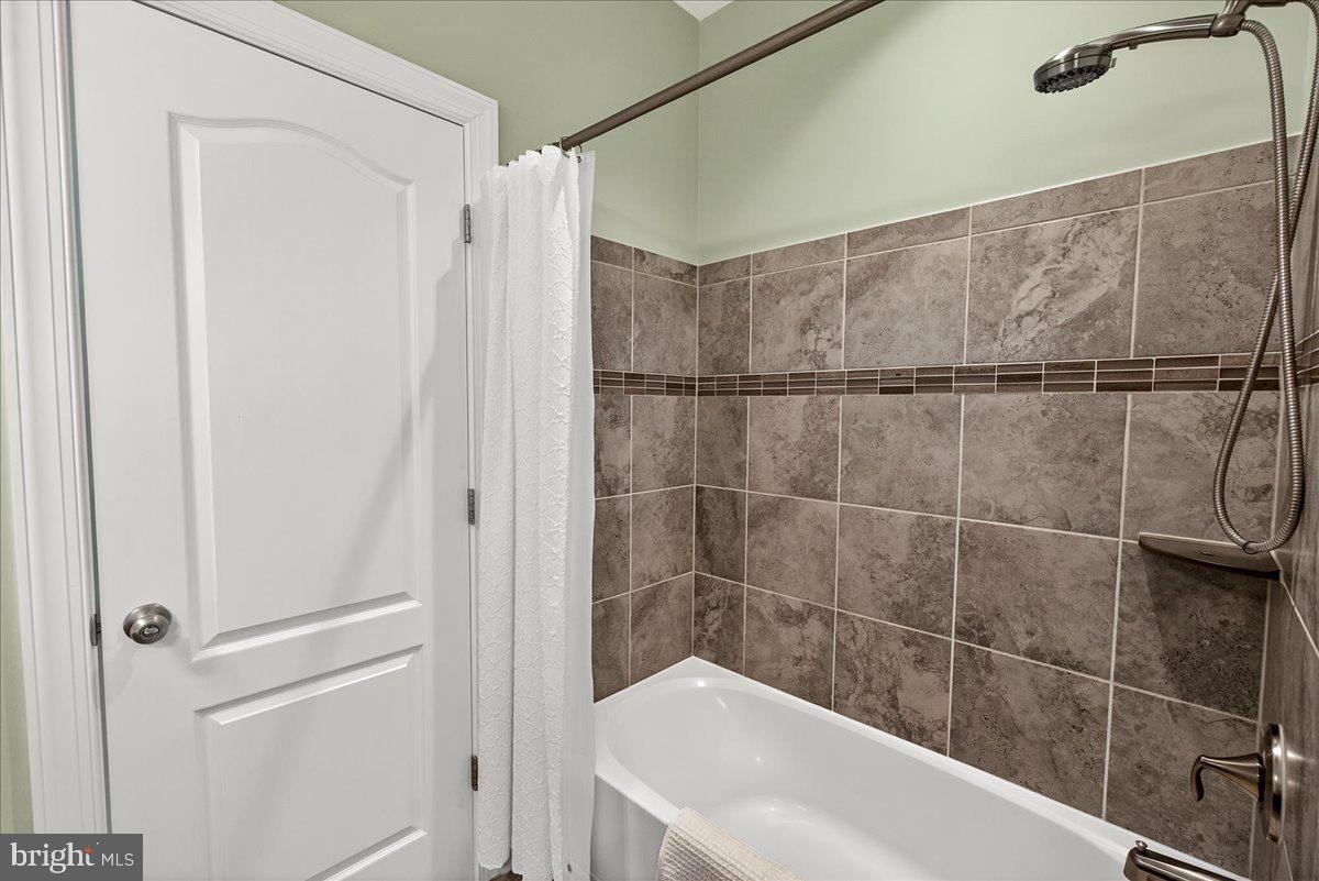 5487 Tallyn Ridge Drive Frederick, MD 21704 - Photo 40 of 80 a bathroom with a shower and a sink