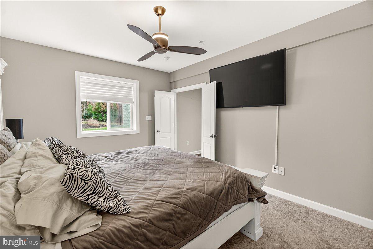 5487 Tallyn Ridge Drive Frederick, MD 21704 - Photo 45 of 80 a bedroom with a large bed and a flat screen tv