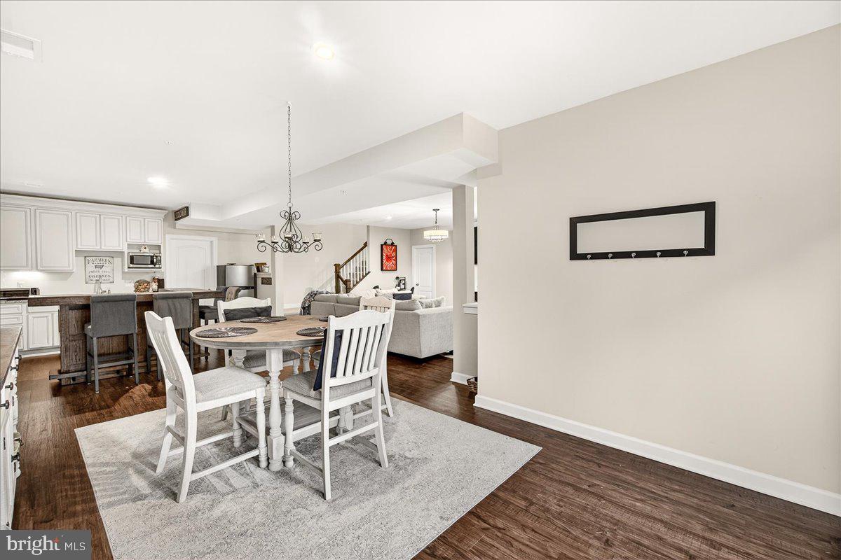 5487 Tallyn Ridge Drive Frederick, MD 21704 - Photo 56 of 80 a view of a dining room with furniture