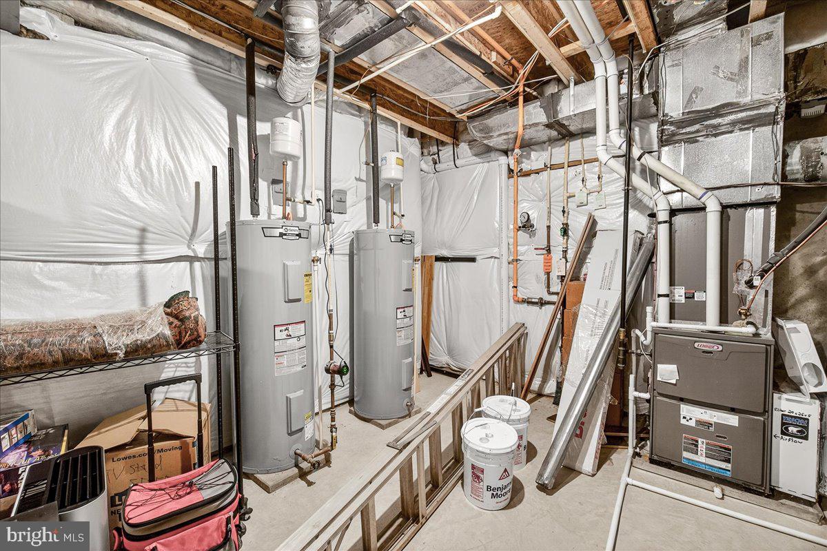 5487 Tallyn Ridge Drive Frederick, MD 21704 - Photo 65 of 80 a view of walk in closet with clothes and shoes