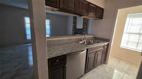 a kitchen with a stove and a microwave