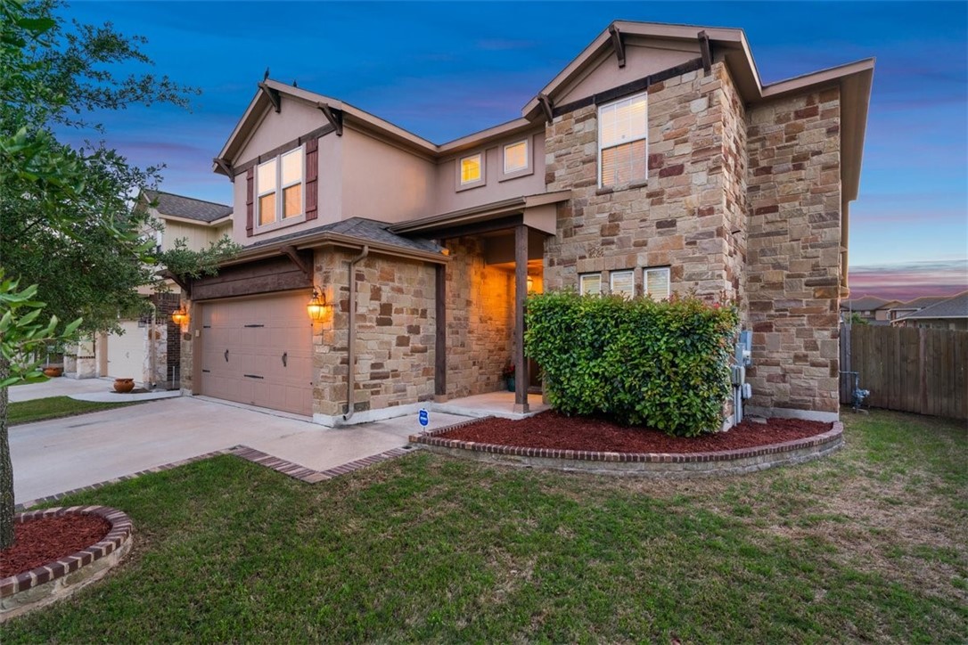 8234 Angelo Loop Round Rock, TX 78665 - Photo 1 of 1 a front view of a house with garden