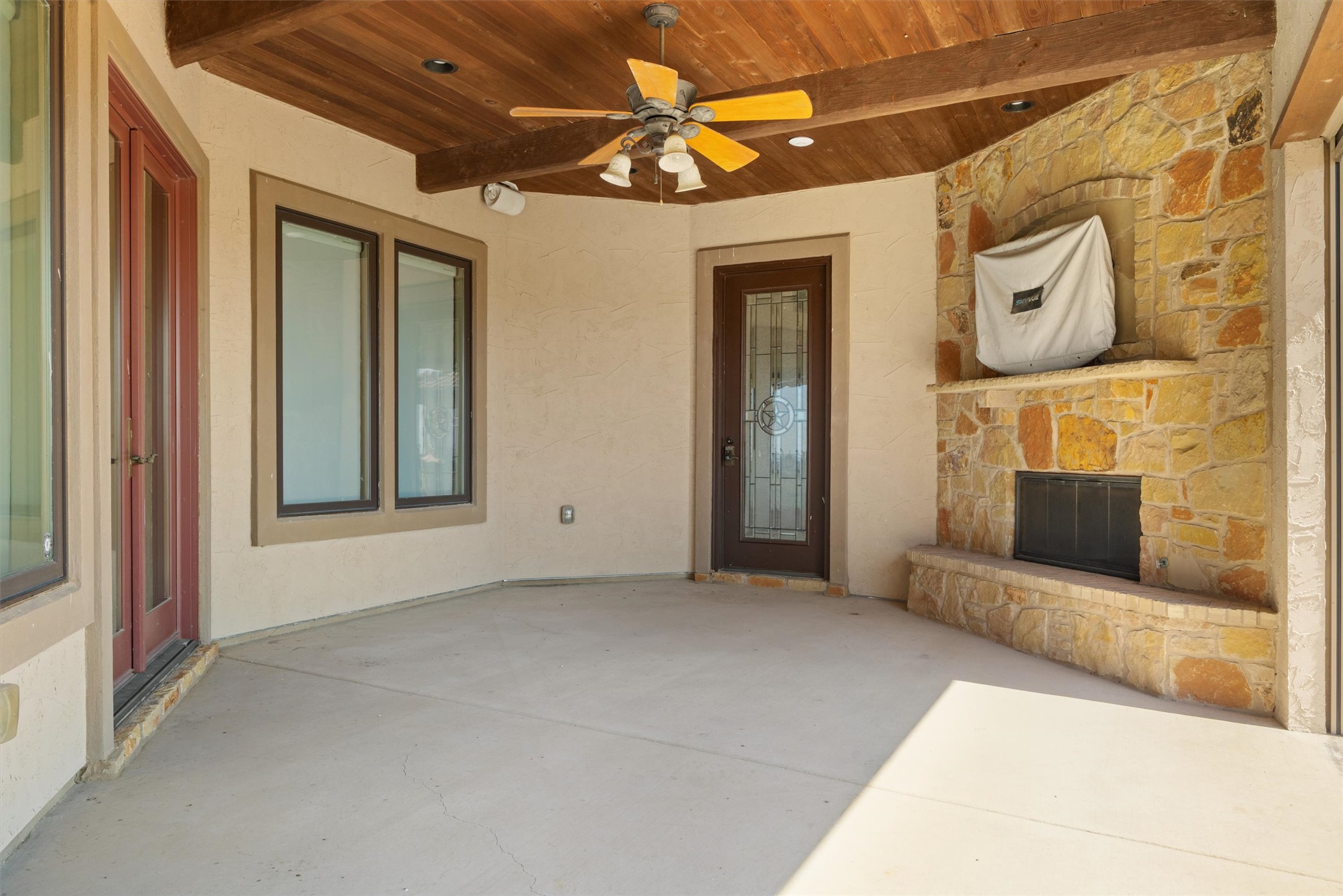 14502 Lund - Carlson Road Coupland, TX 78615 - Photo 31 of 40 Covered patio with fireplace