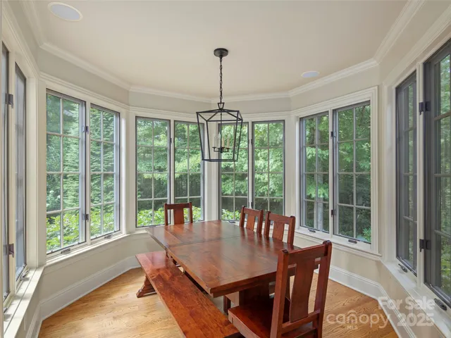 a dining room with furniture window and outside view
