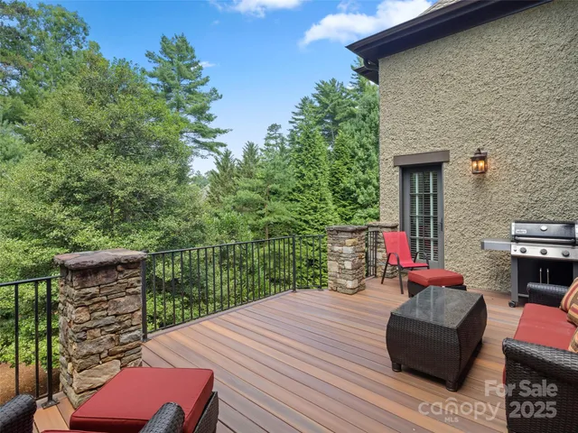 a deck with couch and wooden floor