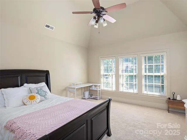 a bed room with a bed and a window