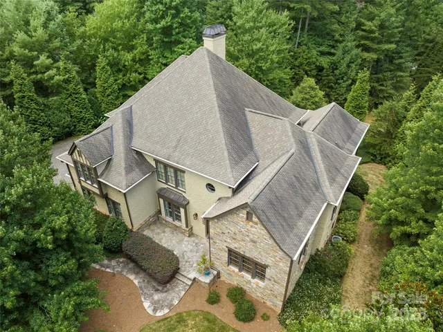 a house with trees in the background