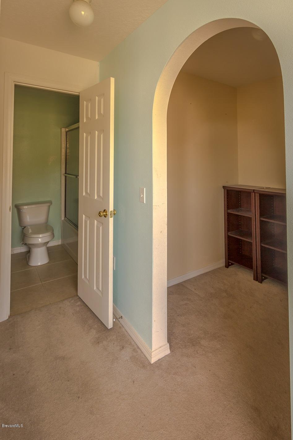 4785 Elena Way Melbourne, FL 32934 - Photo 17 of 19 Master bedroom closet/bath