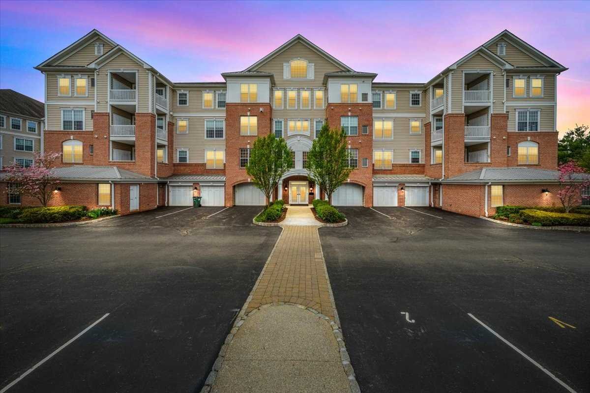 a view of building with lot of windows and yard