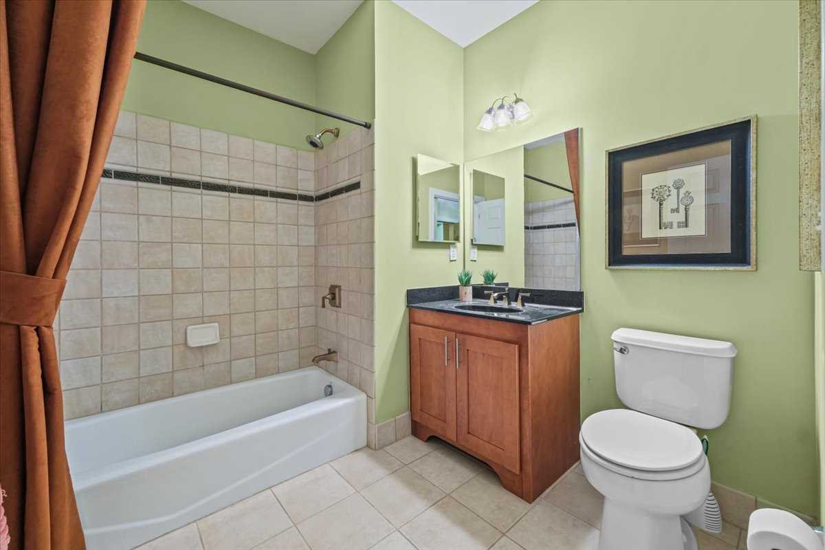 123 Regency Drive Fishkill, NY 12524 - Photo 14 of 28 a bathroom with a granite countertop toilet a sink and bathtub