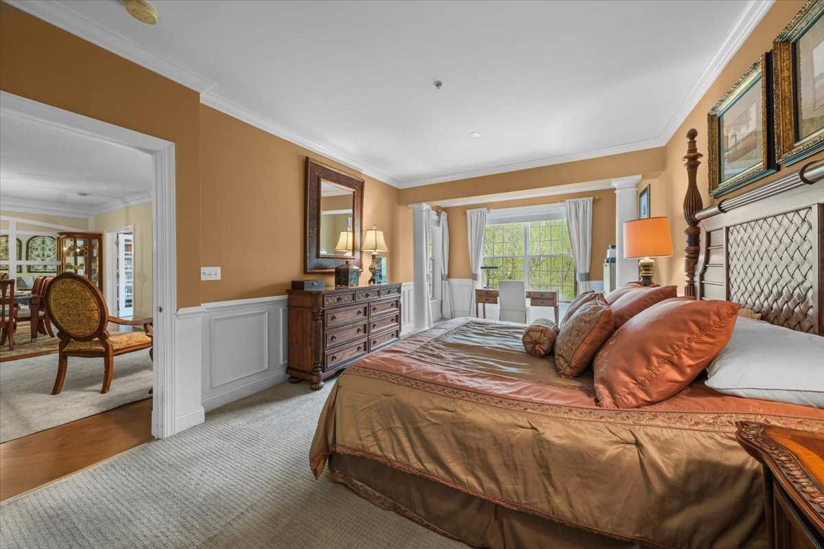 123 Regency Drive Fishkill, NY 12524 - Photo 15 of 28 a bedroom with a bed and large windows