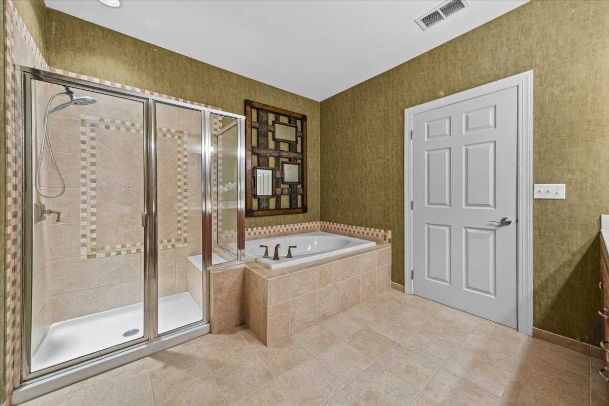 123 Regency Drive Fishkill, NY 12524 - Photo 19 of 28 a spacious bathroom with a tub shower and mirror