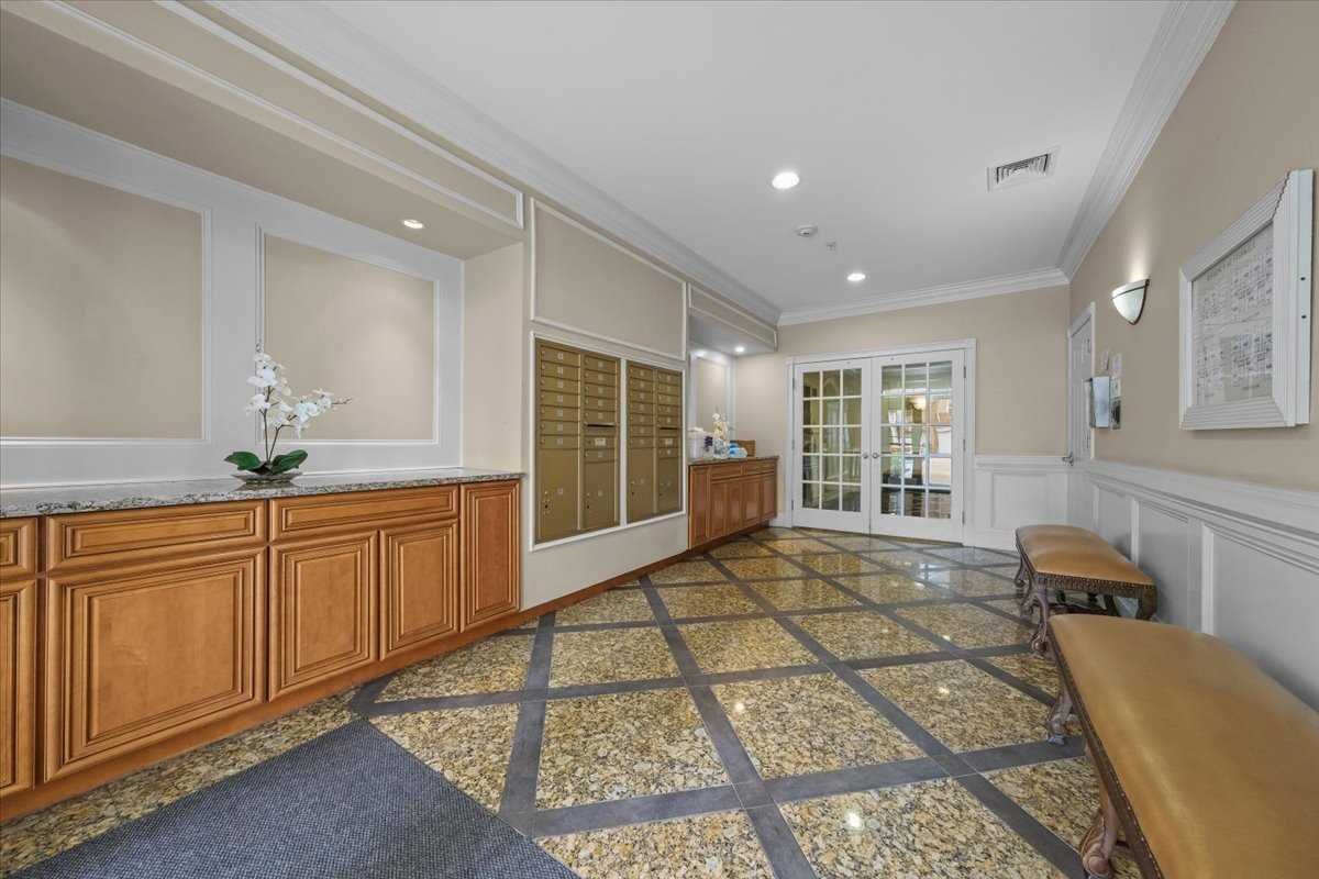 123 Regency Drive Fishkill, NY 12524 - Photo 23 of 28 a spacious bathroom with a granite countertop sink a mirror and a shower