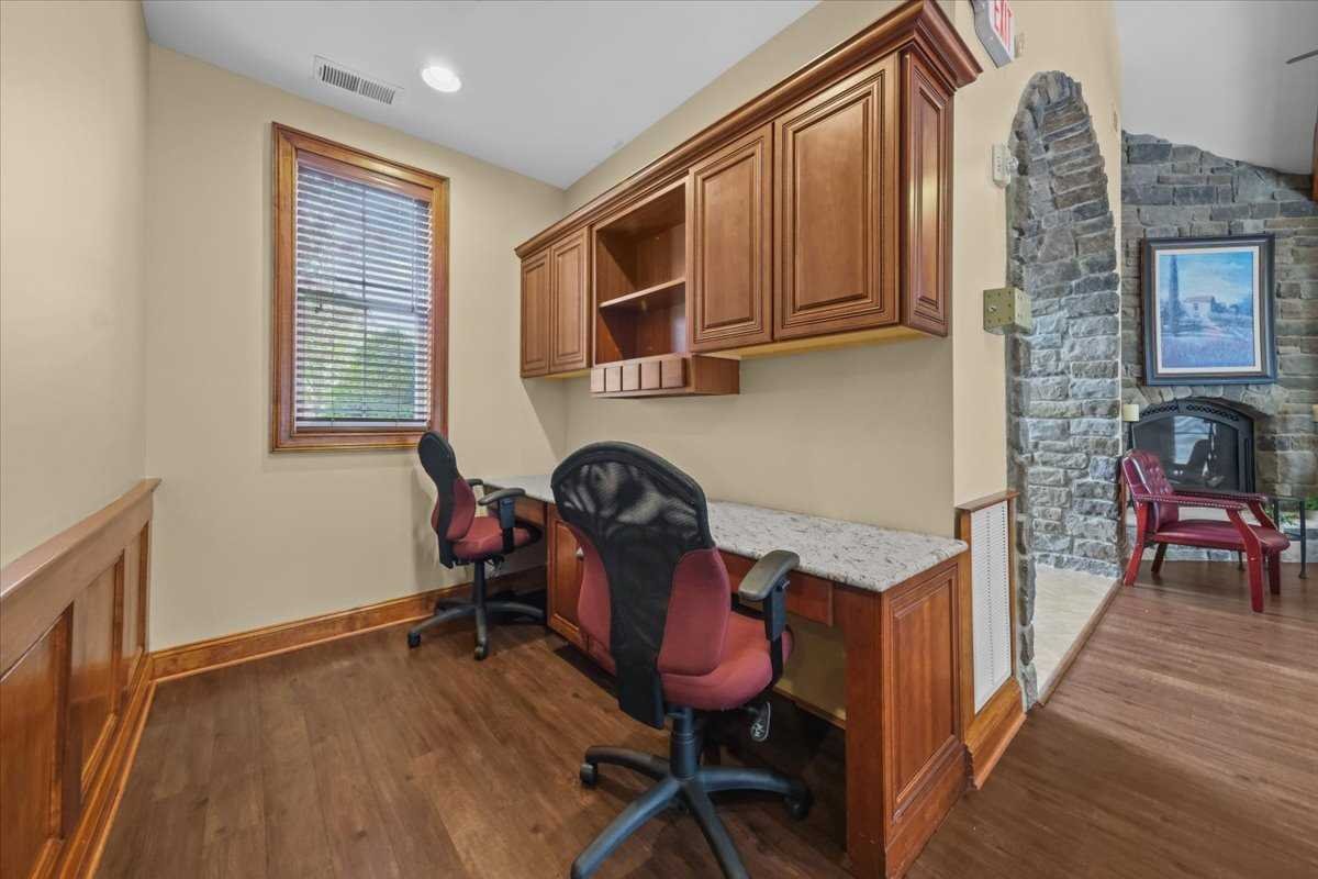 123 Regency Drive Fishkill, NY 12524 - Photo 26 of 28 a workspace with wooden floor and furniture