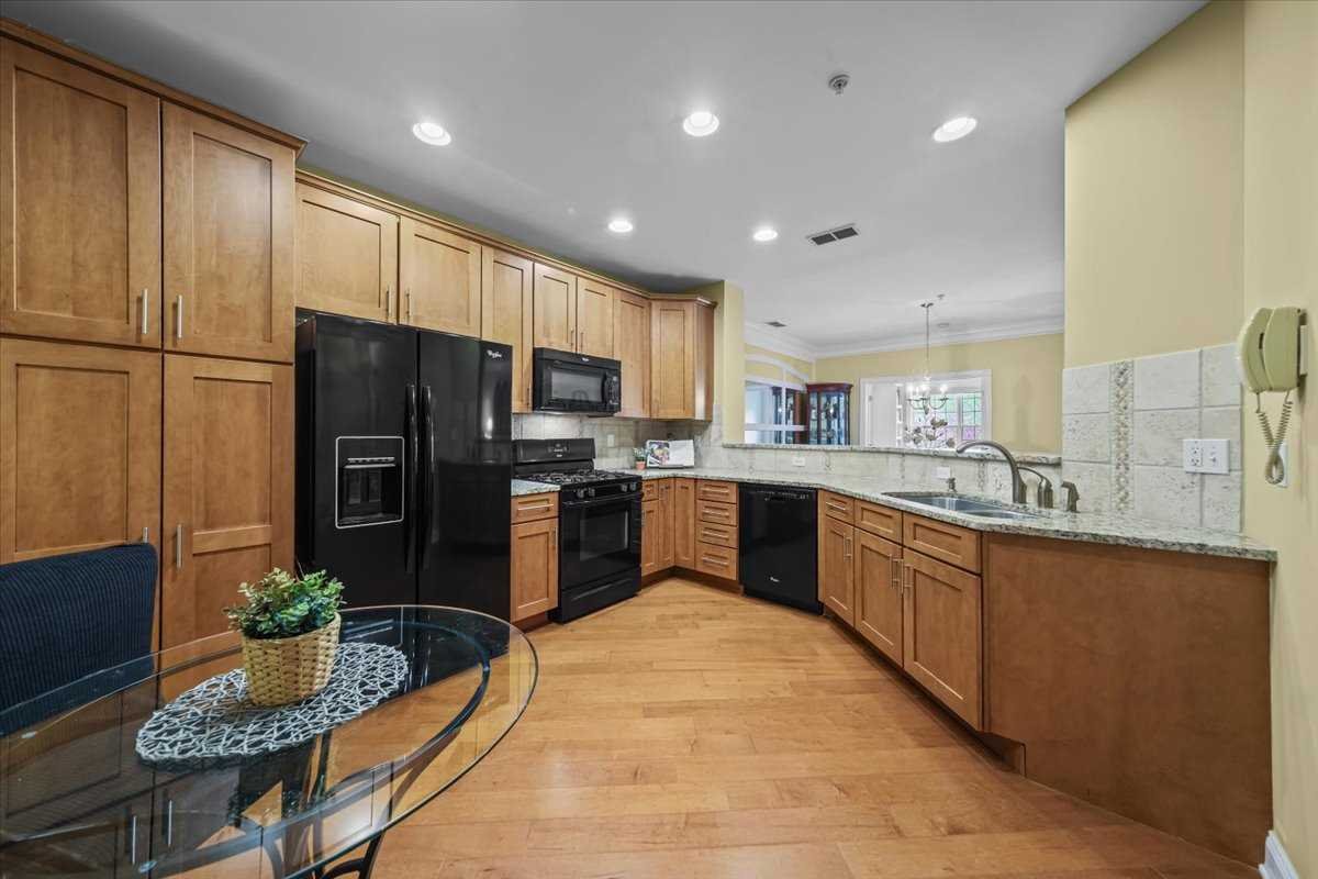 123 Regency Drive Fishkill, NY 12524 - Photo 4 of 28 a large kitchen with stainless steel appliances kitchen island granite countertop a refrigerator and a sink