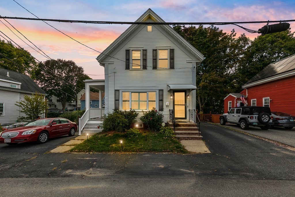 a front view of a house with a yard