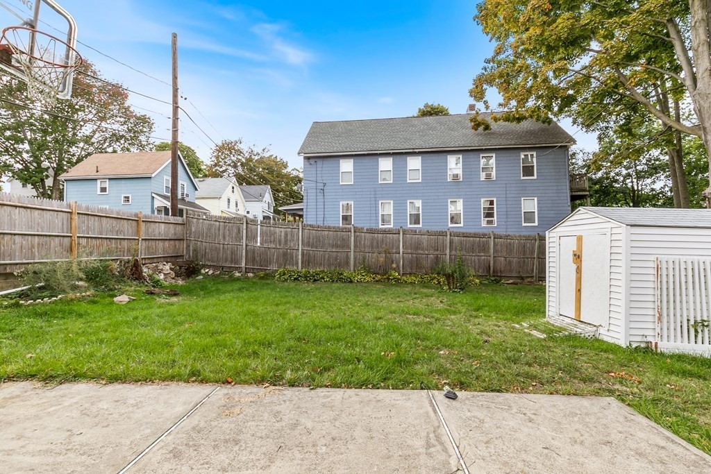 44 Wright Street Stoneham, MA 02180 - Photo 19 of 38 a view of a house with a backyard