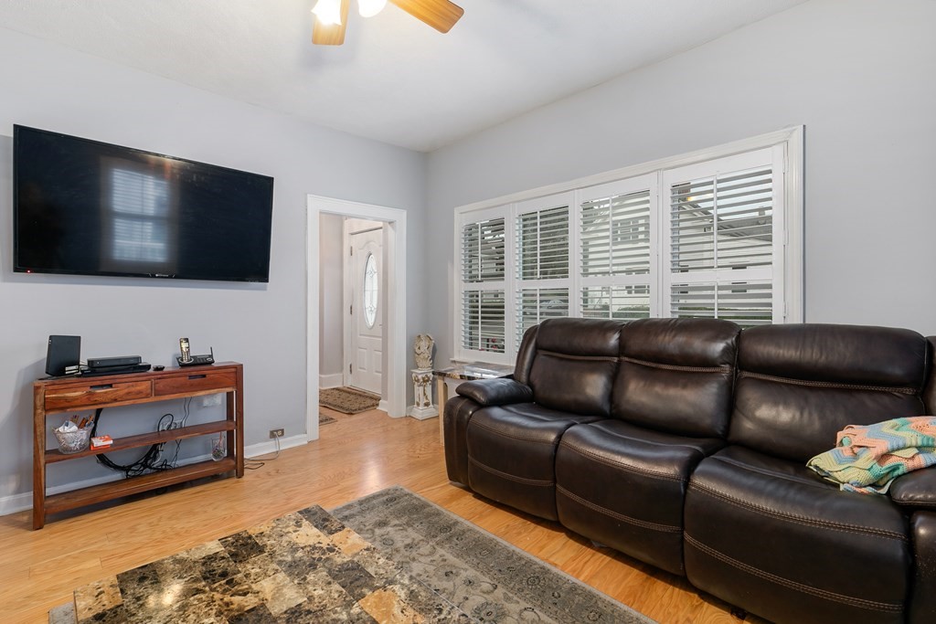 44 Wright Street Stoneham, MA 02180 - Photo 27 of 38 a living room with furniture and a flat screen tv
