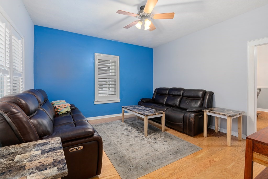 44 Wright Street Stoneham, MA 02180 - Photo 31 of 38 a living room with furniture rug and wooden floor
