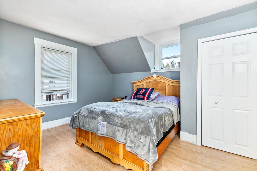 44 Wright Street Stoneham, MA 02180 - Photo 37 of 38 a bedroom with a bed and a window