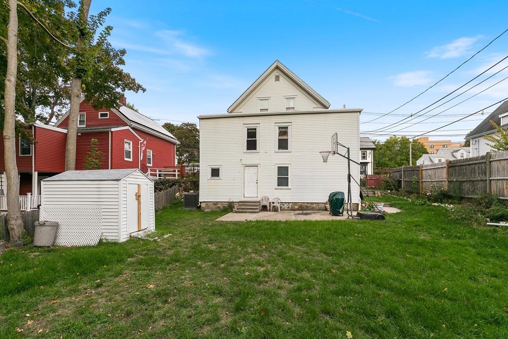 44 Wright Street Stoneham, MA 02180 - Photo 38 of 38 a view of a house with a yard