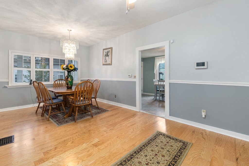 44 Wright Street Stoneham, MA 02180 - Photo 5 of 38 a dining room with furniture and wooden floor