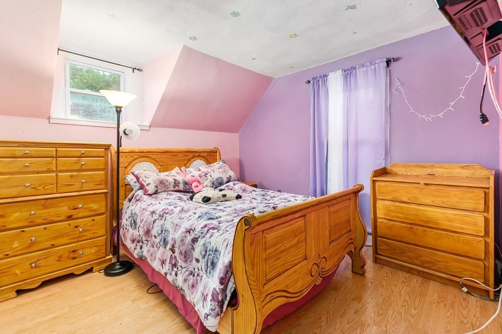 44 Wright Street Stoneham, MA 02180 - Photo 6 of 38 a bedroom with a bed and a dresser