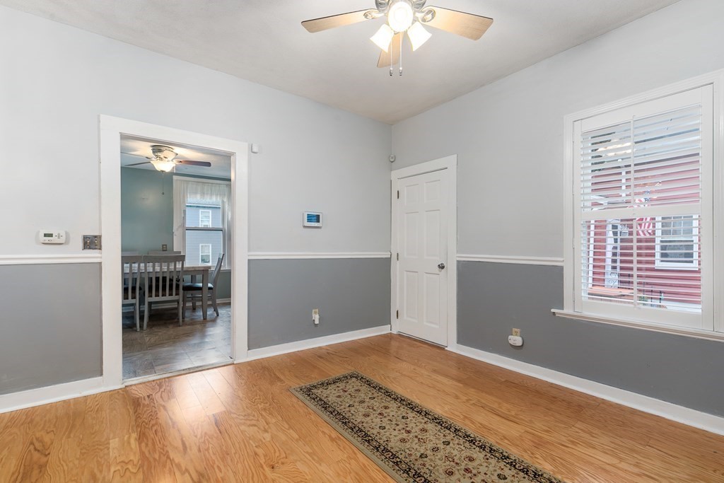 44 Wright Street Stoneham, MA 02180 - Photo 10 of 38 a view of room with window and wooden floor