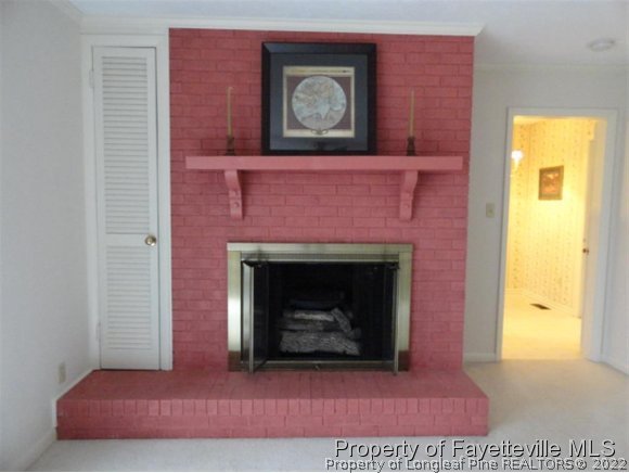 4667 Legion Road Hope Mills, NC 28348 - Photo 11 of 24 a living room with a fireplace