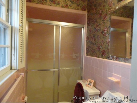 4667 Legion Road Hope Mills, NC 28348 - Photo 12 of 24 a bathroom with a shower