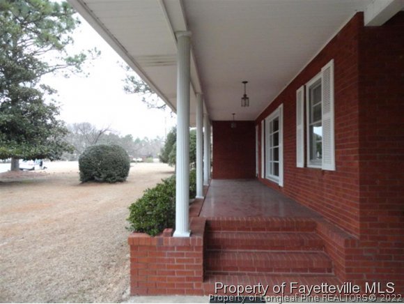4667 Legion Road Hope Mills, NC 28348 - Photo 21 of 24 a view of a porch