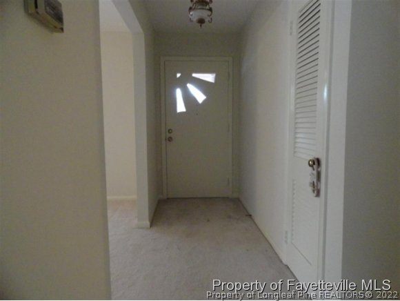 4667 Legion Road Hope Mills, NC 28348 - Photo 8 of 24 a view of a hallway with wooden floor and windows
