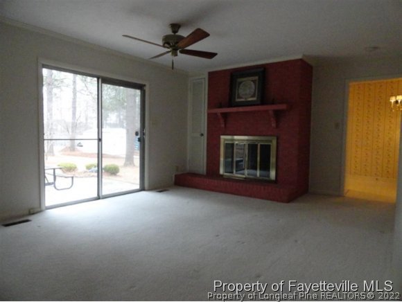 4667 Legion Road Hope Mills, NC 28348 - Photo 10 of 24 a living room with furniture and a fireplace