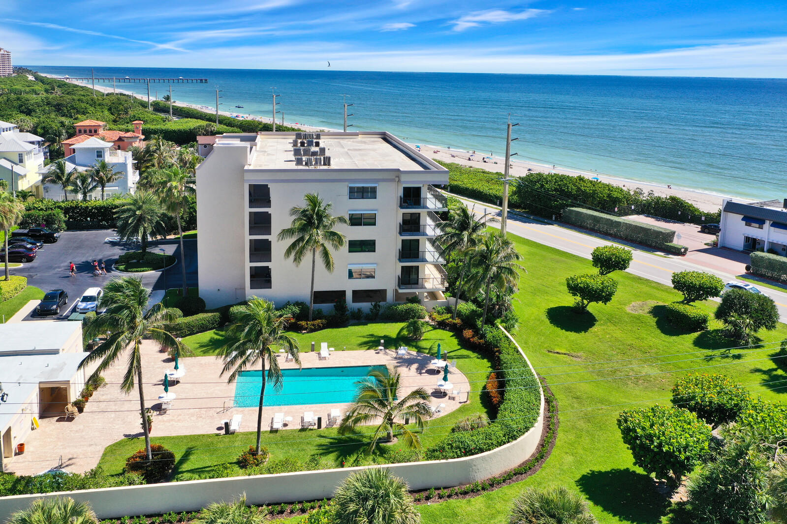 1055 Ocean Drive, Unit 401 Juno Beach, FL 33408 - Photo 1 of 31 Aerial facing North with pool