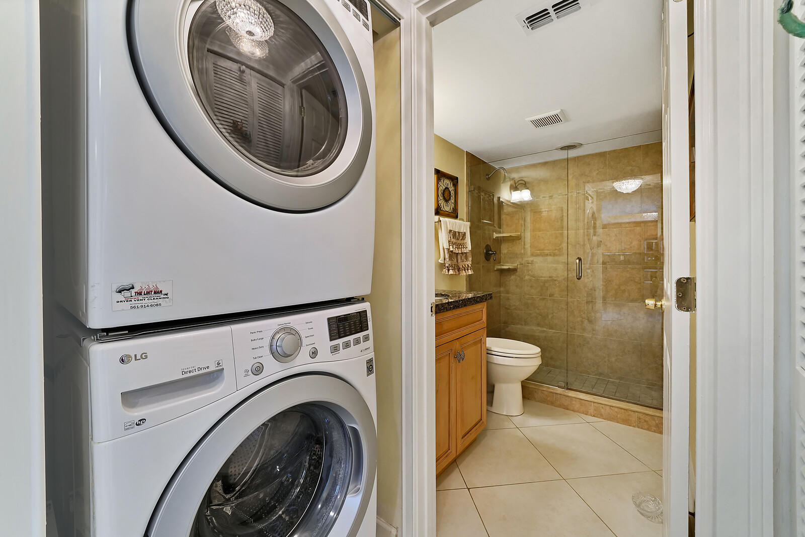 1055 Ocean Drive, Unit 401 Juno Beach, FL 33408 - Photo 28 of 31 Guest bath and laundry