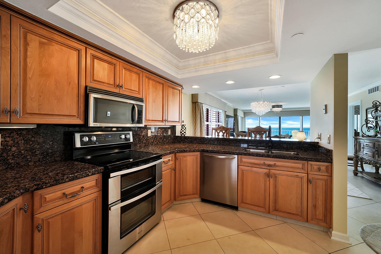 1055 Ocean Drive, Unit 401 Juno Beach, FL 33408 - Photo 7 of 31 Kitchen with stainless steel appliances
