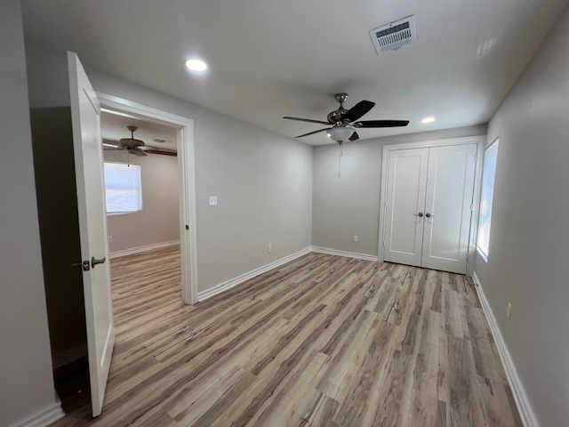 407 1/2 Walton Street Houston, TX 77009 - Photo 11 of 14 wooden floor in an empty room with a window
