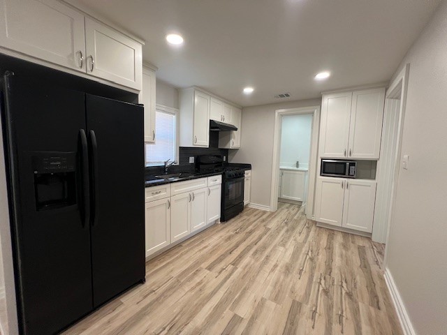 407 1/2 Walton Street Houston, TX 77009 - Photo 8 of 14 a kitchen with granite countertop a refrigerator oven a sink and dishwasher