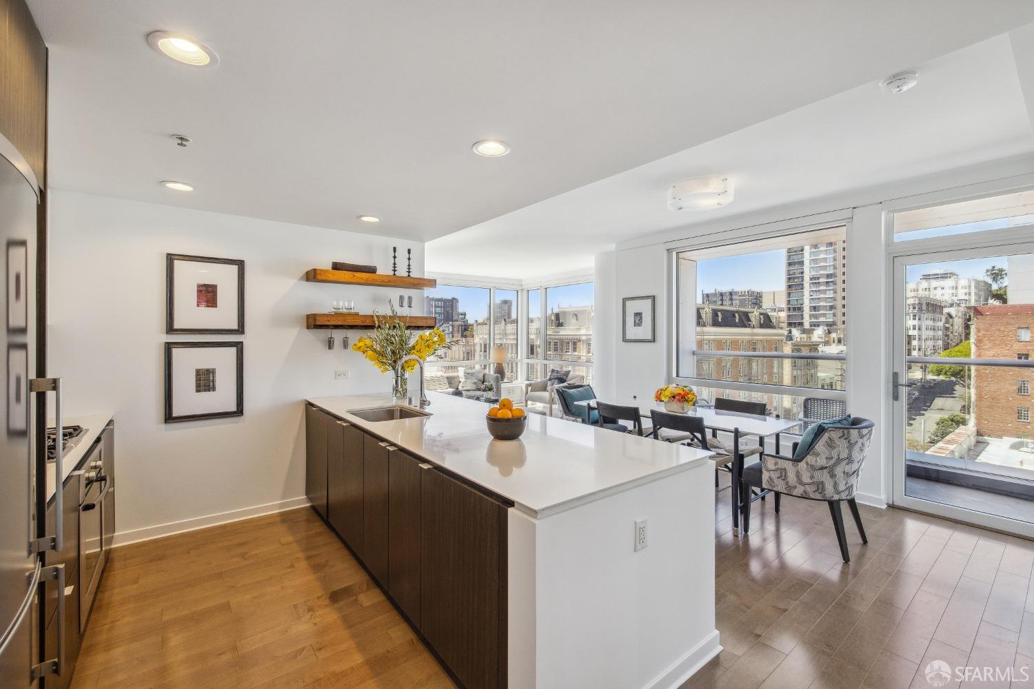 a view of kitchen center island dining table and wooden floor