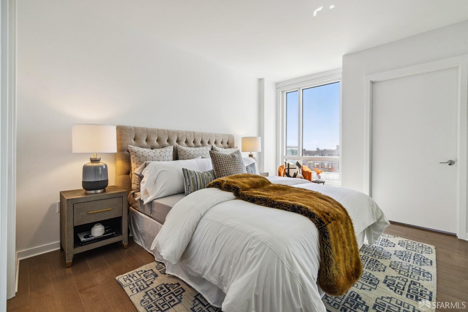 1788 Clay Street, Unit 807 San Francisco, CA 94109 - Photo 15 of 28 a bed room with a bed and a chair