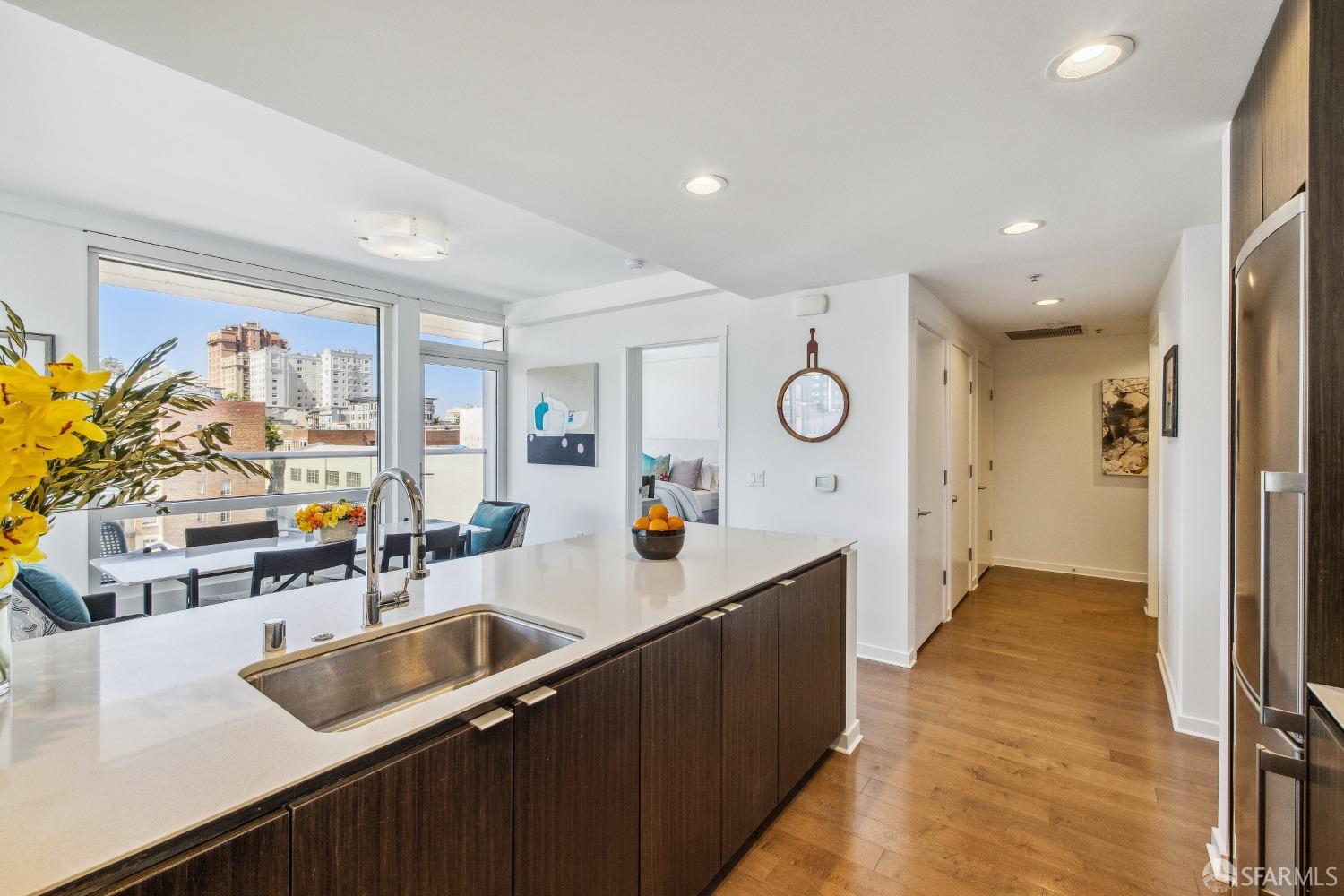 1788 Clay Street, Unit 807 San Francisco, CA 94109 - Photo 19 of 28 a kitchen with stainless steel appliances a sink stove and cabinets