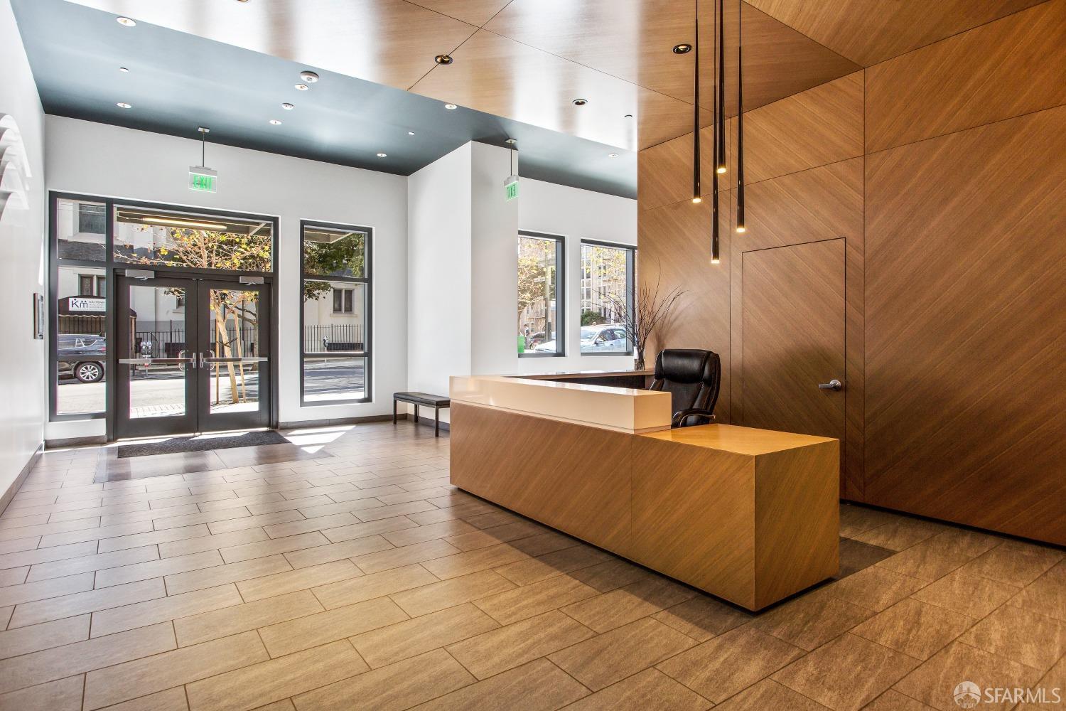 1788 Clay Street, Unit 807 San Francisco, CA 94109 - Photo 4 of 28 a living room with hard wood floors and a large window