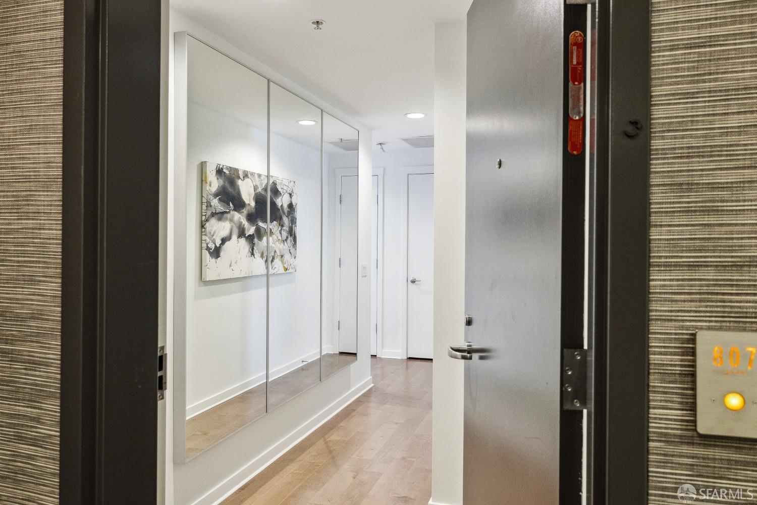 1788 Clay Street, Unit 807 San Francisco, CA 94109 - Photo 5 of 28 a view of a hallway with wooden floor