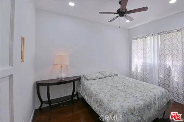 a bedroom with a bed and a table