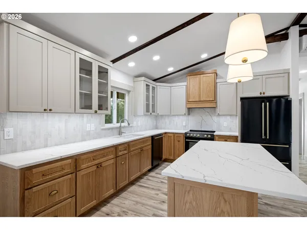 a kitchen with a sink a stove and refrigerator