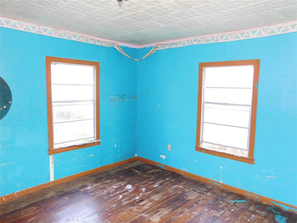 104 North Pecan Avenue Hubbard, TX 76648 - Photo 15 of 21 a view of a room that has a window in it