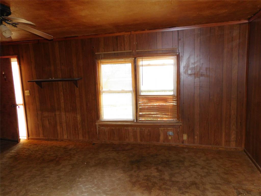104 North Pecan Avenue Hubbard, TX 76648 - Photo 7 of 21 a view of an empty room with a window