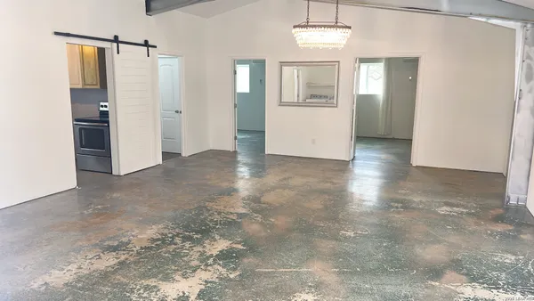 a bathroom with a shower and a sink