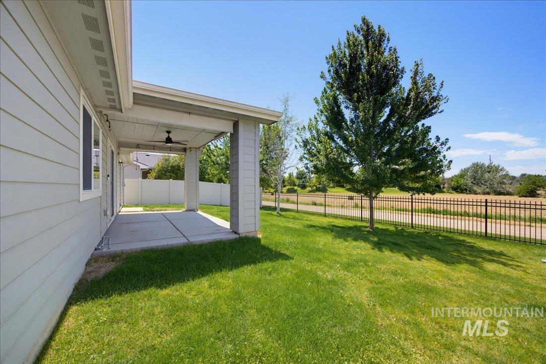 5317 West Lockner Street Eagle, ID 83616 - Photo 25 of 34 Fully fenced backyard borders community walking path and canal.