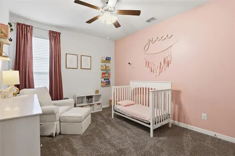 a bedroom with a white bed and white walls